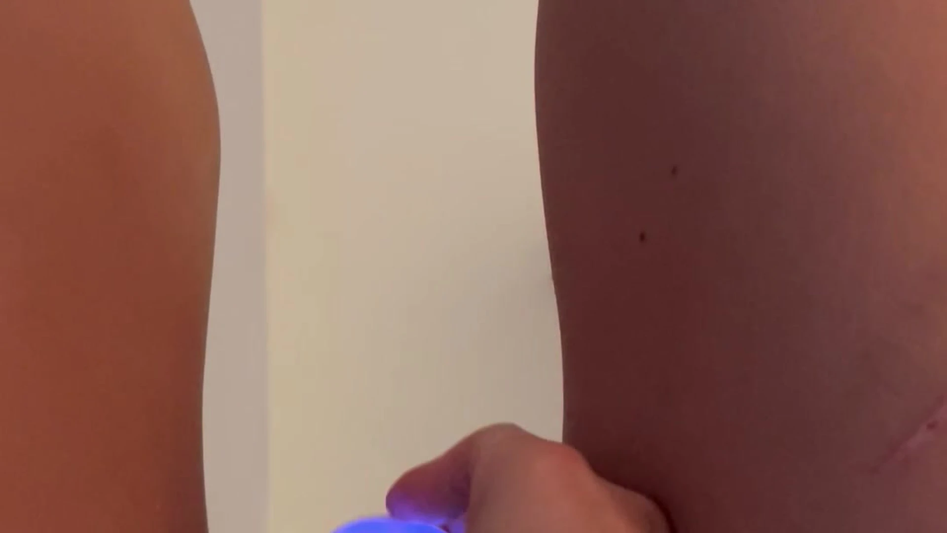 Lillian Phillips inserting a dildo into her pussy