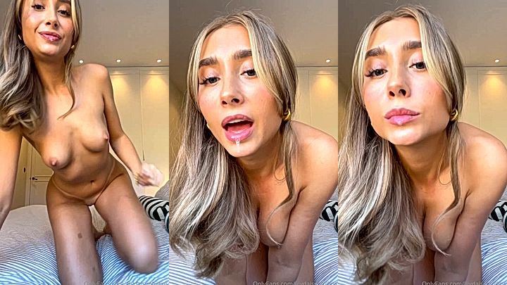 naked taking a selfie spiting and playing with her tits