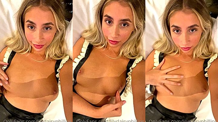 onlyfans Lillian Phillips taking a selfie with her tits exposed