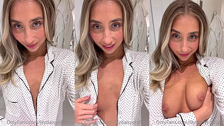 Lillian Phillips opes up her shirt button exposing her tits