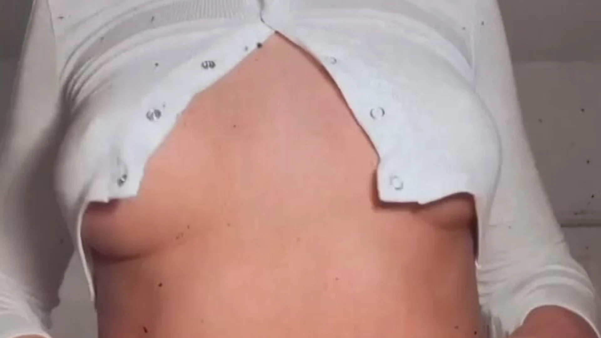 Lillian Phillips opening up her top playing with tits on camera